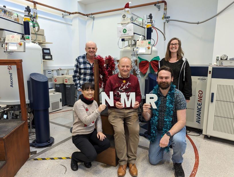 Group photo of the NMR Facility team celebrating the new equipment.