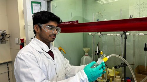 Photo of new EaStCHEM PhD student Aasyush Anand in the lab.