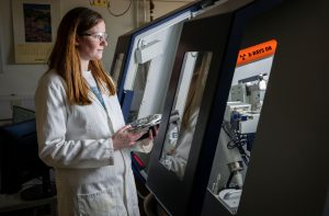 A female researcher works in the lab.